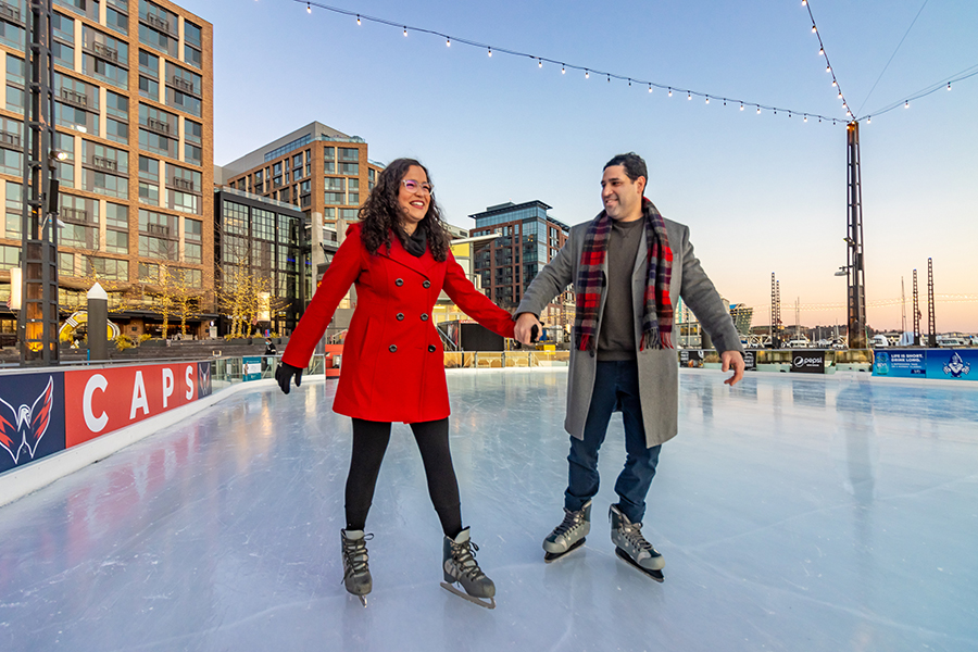 Couple ice skating at The Wharf