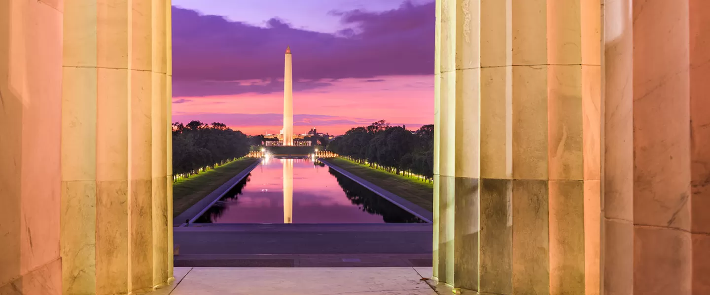 view of the Washington Monument and Reflecting Pool from the Lincoln Memorial with pretty sunset colors