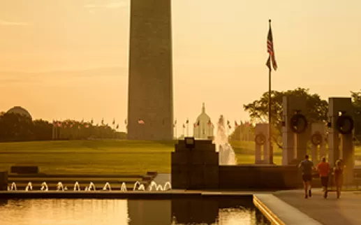 Group of people running beside Reflecting Pool on National Mall
