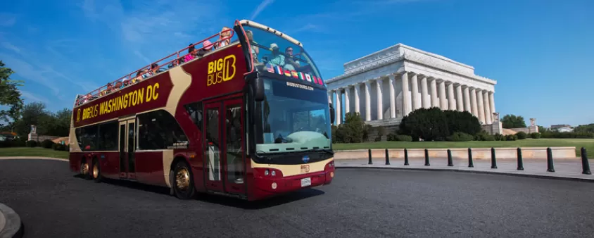 Big Bus tour in front of Lincoln Memorial - Eco-friendly group tour options in Washington, DC